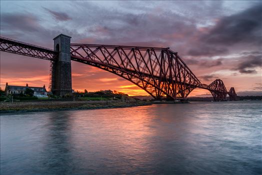 A photograph of the Forth Rail Bridge taken at Sunrise from North Queensferry.