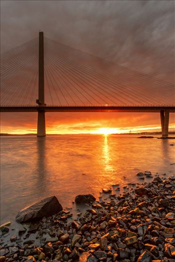 A photograph of the Queensferry crossing taken at sunset from North Queensferry.