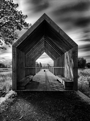 A black and white photograph of the boathouse at Larbert loch within the grounds of Forth Valley Royal Hospital.