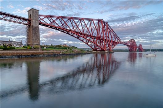 A photograph of the Iconic Forth Rail Bridge taken on a calm summers evening from North Queensferry.