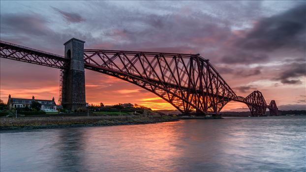 A photograph of the Forth Rail Bridge taken at Sunrise from North Queensferry.