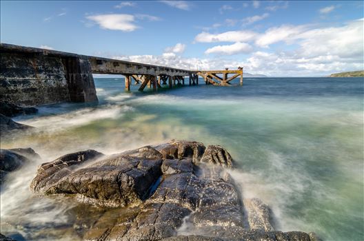 A photograph of the pier at Portenross looking over towards the Isle of Arran.