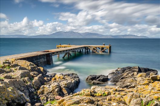 A photograph of the pier at Portenross looking over towards the Isle of Arran.