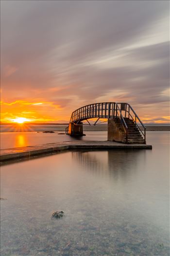 A photograph of the Belhaven Bridge at Dunbar taken at sunset.